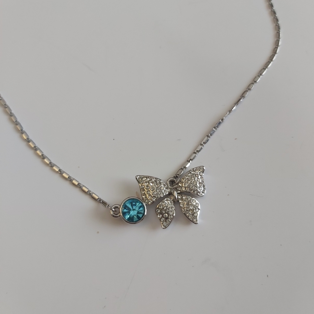 18 KGP Elegant Silver Bow Necklace with Blue Accent